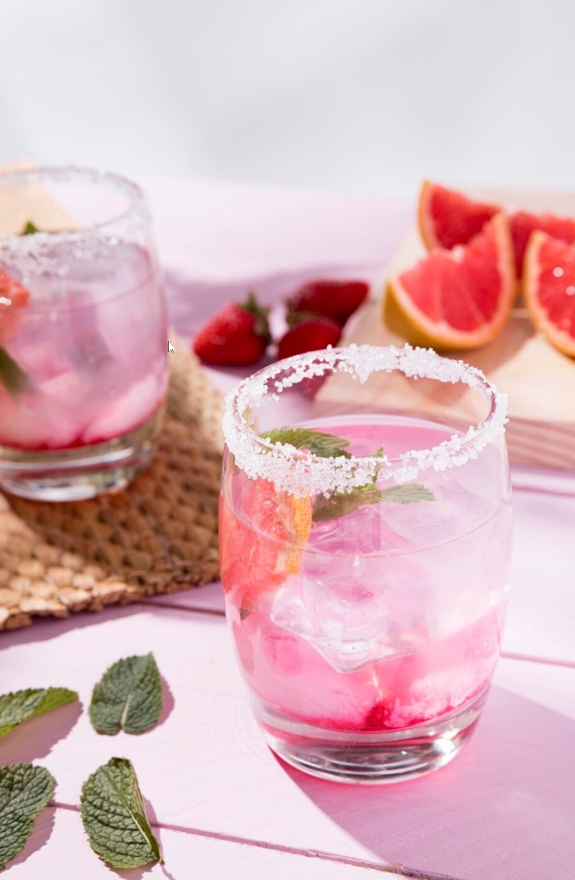 Rosado Hibiscus Cooler with pink citrus, mint, and salted rim
